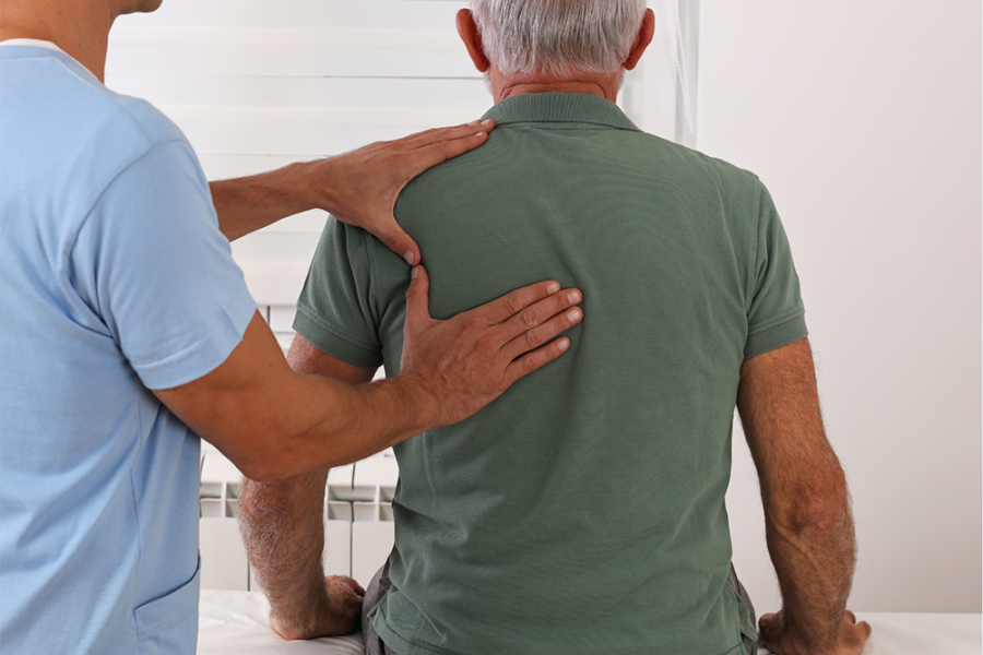 Man having physio on his back
